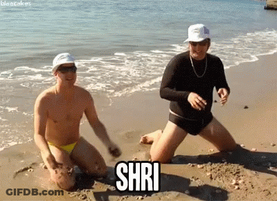 Two Men Kneeling On Beach Shri GIF