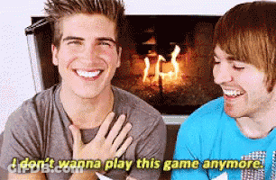 Two Men Laughing By Fireplace Says I Don't Wanna Play This Game Anymore GIF