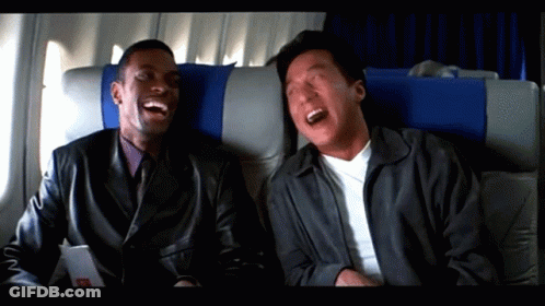 Two Men Laughing On Airplane GIF