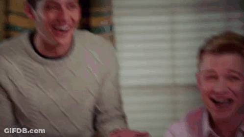 Two Men Laughing Playing Video Game GIF