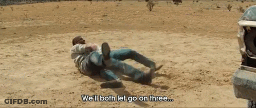 Two Men Laying On The Ground With The Words We 'Ll Both Let Go On Three GIF
