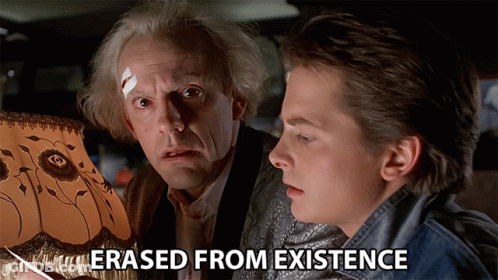 Two Men Looking At A Lamp With The Words " Erased From Existence " Above Them GIF