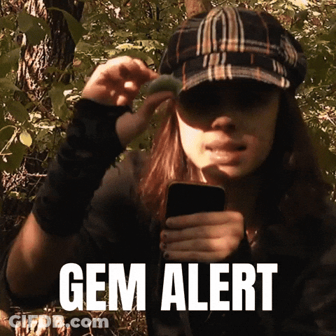Two Men Looking At Cell Phone And Magnifying Glass GIF
