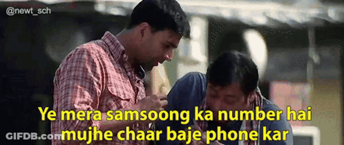 Two Men Looking At Cell Phone With Foreign Caption GIF