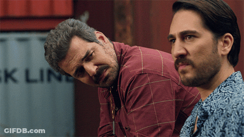 Two Men Looking At Container Saying Ck Line GIF