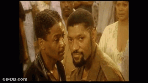 Two Men Looking At Each Other GIF