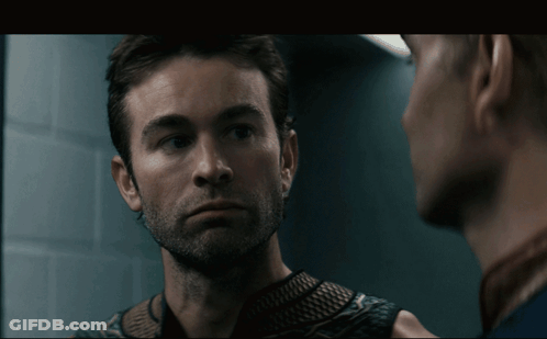 Two Men Looking At Each Other In Mirror GIF