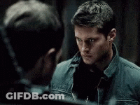 Two Men Looking At Each Other In Mirror GIF