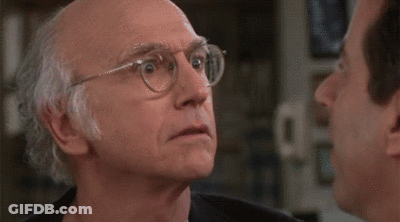Two Men Looking At Each Other One In Pink Shirt GIF
