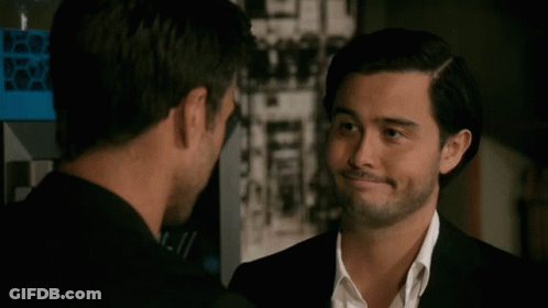 Two Men Looking At Each Other One With Beard GIF