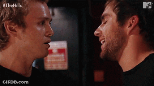 Two Men Looking At Each Other GIF