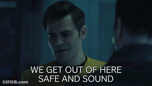 Two Men Looking At Each Other Saying We Get Out Of Here Safe And Sound GIF