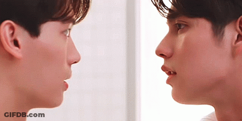 Two Men Looking At Each Other With Mouths Open GIF