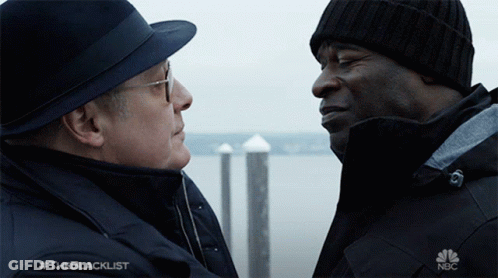Two Men Looking At Each Other With NBC Logo GIF
