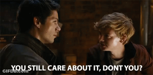 Two Men Looking At Each Other With The Words " You Still Care About It , Don 'T You ? " GIF