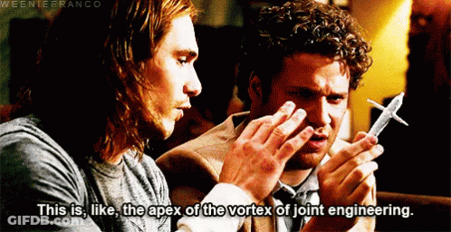 Two Men Looking At Model Airplane GIF