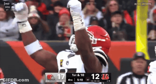 Two Men Looking At Trophy With Stadium Sign GIF