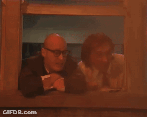 Two Men Looking Out Window Purple Light GIF