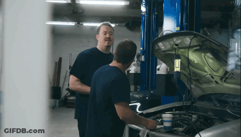 Two Men Looking Under Car Hood GIF