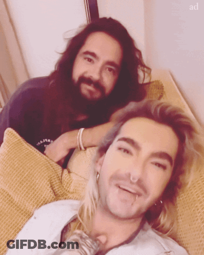 Two Men Lying On Couch GIF
