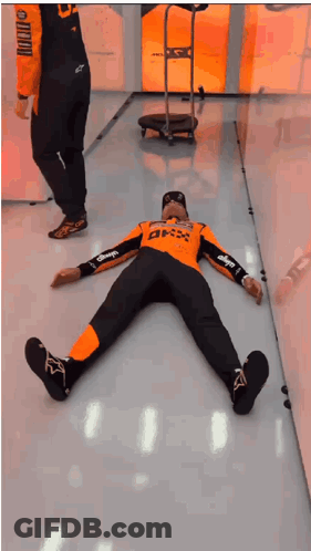 Two Men Lying On Floor With BMX Shirt GIF