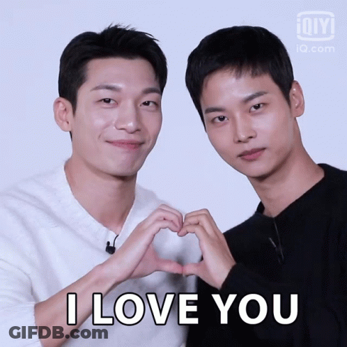 Two Men Make A Heart Shape With Their Hands And The Words I Love You GIF