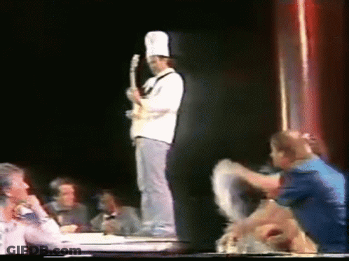 Two Men Next To Caracol Television GIF