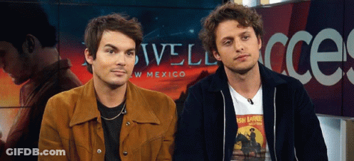 Two Men Next To Mexico Sign GIF