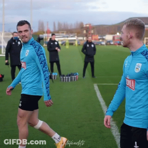 Two Men On A Soccer Field With One Wearing A Shirt That Says Sonia On It GIF