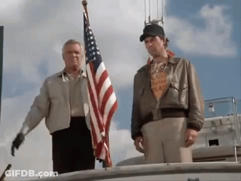 Two Men On Boat With American Flag GIF