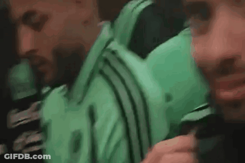 Two Men On Bus One In Green Adidas Shirt GIF