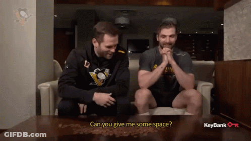 Two Men On Couch Asking For Space GIF
