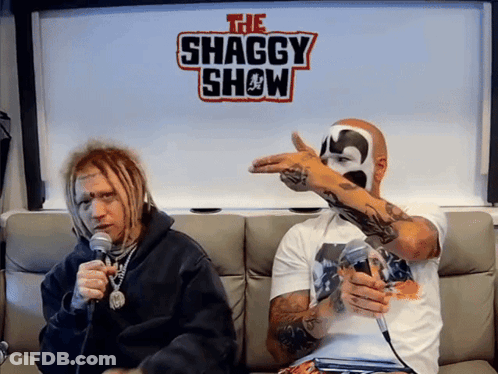 Two Men On Couch In Front Of Shaggy Show Sign GIF