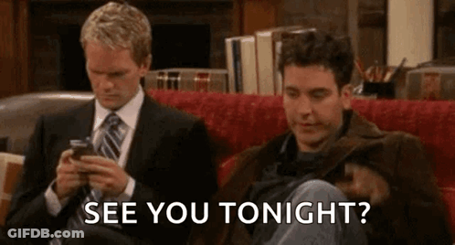 Two Men On Couch Looking At Phones Saying See You Tonight GIF