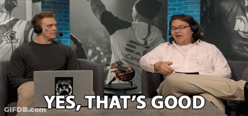 Two Men On Couch One Wearing Care Stand Up Shirt GIF
