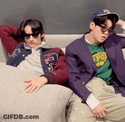 Two Men On Couch One Wearing Property Of Pol Shirt GIF