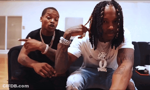 Two Men On Couch One With 0 Necklace GIF
