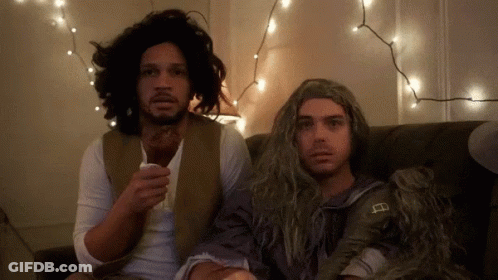 Two Men On Couch One With Wig GIF