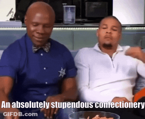 Two Men On Couch Saying Absolutely Stupendous Confectionary GIF