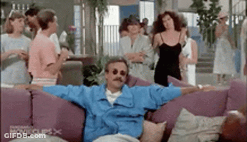 Two Men On Couch Saying What Kind Of Host GIF