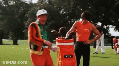 Two Men On Golf Course With Golf Bag GIF