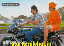 Two Men On Motorcycle One In Orange Turban GIF