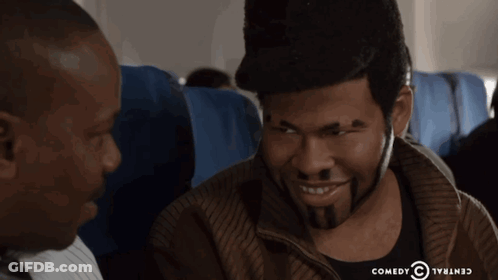 Two Men On Plane With Comedy Central Logo GIF