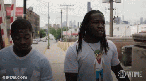 Two Men On Sidewalk With Showtime GIF