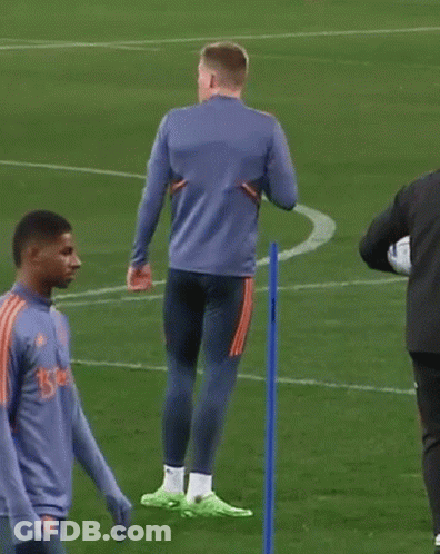 Two Men On Soccer Field One In Blue Adidas GIF