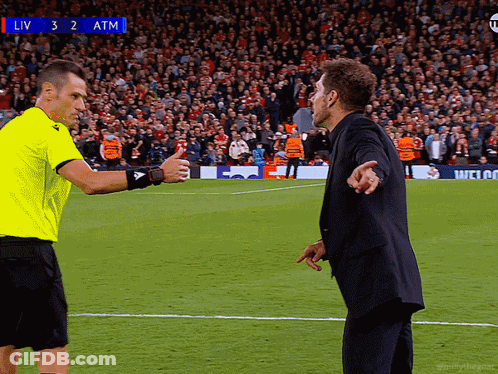 Two Men On Soccer Field With Scoreboard Saying Liv 3 2 Atm GIF