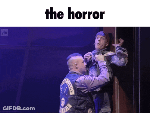 Two Men On Stage Saying The Horror GIF