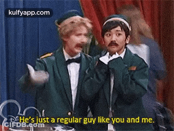 Two Men On Stage Talking About Regular Guy GIF