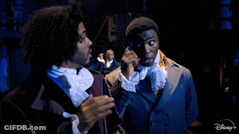 Two Men On Stage With Disney+ Logo GIF