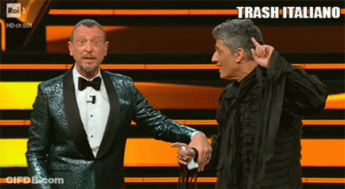 Two Men On Stage With Trash Italiano GIF
